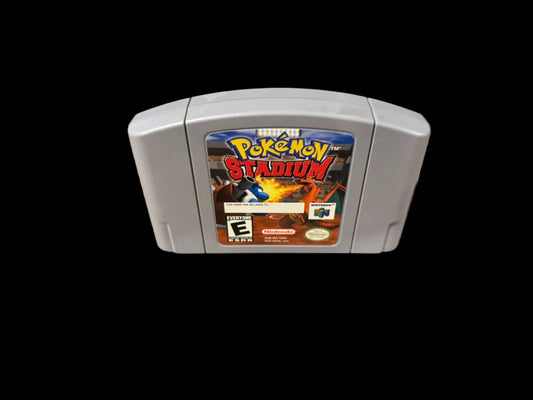 Pokémon Stadium game cartridge on a wooden surface
